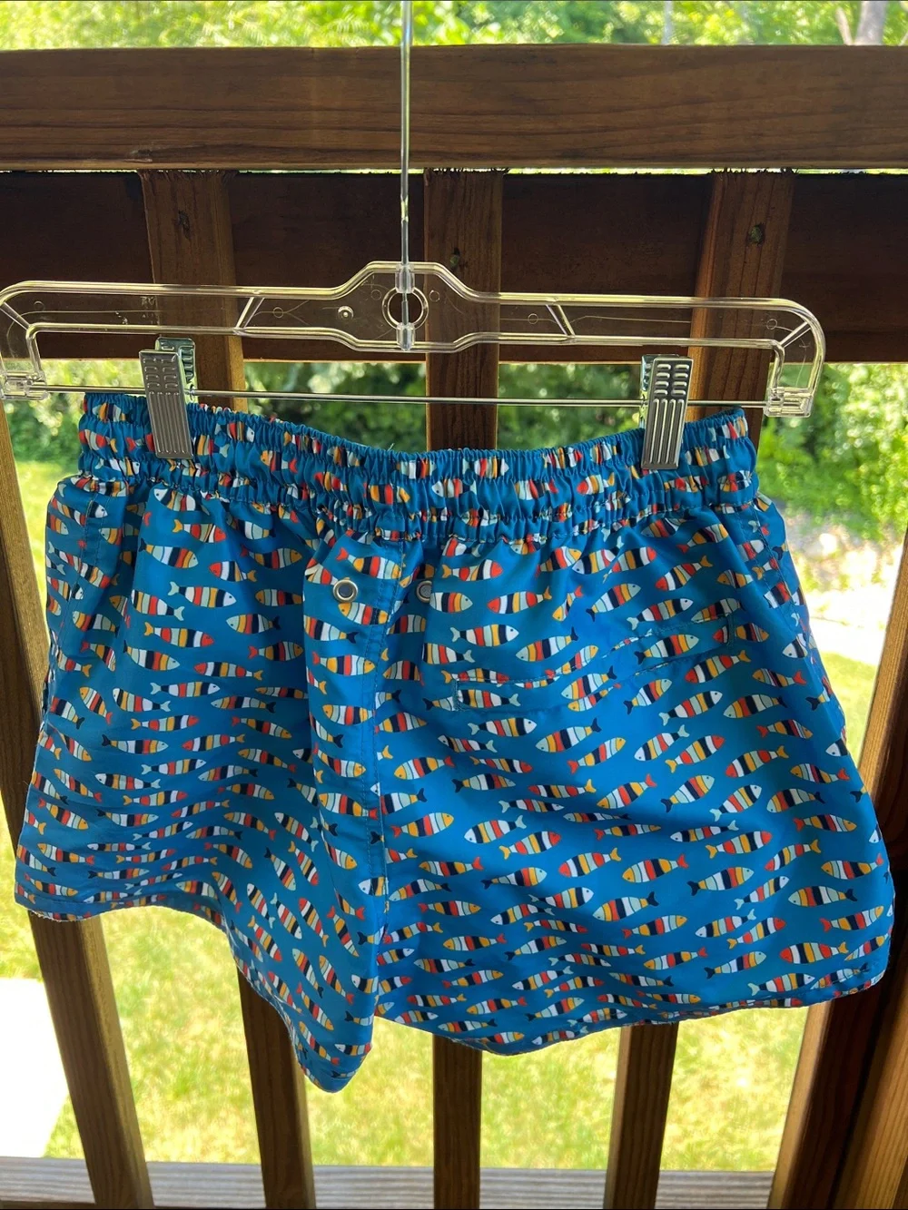 Tailored, men’s swim trunks with all over fish pattern